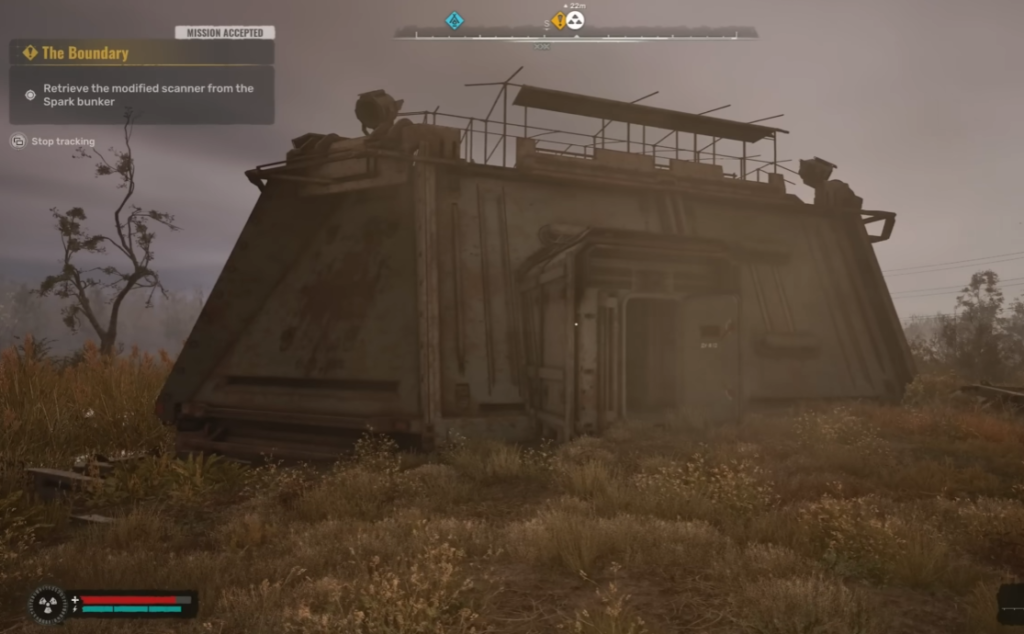 Concrete bunker in grassy field at dusk