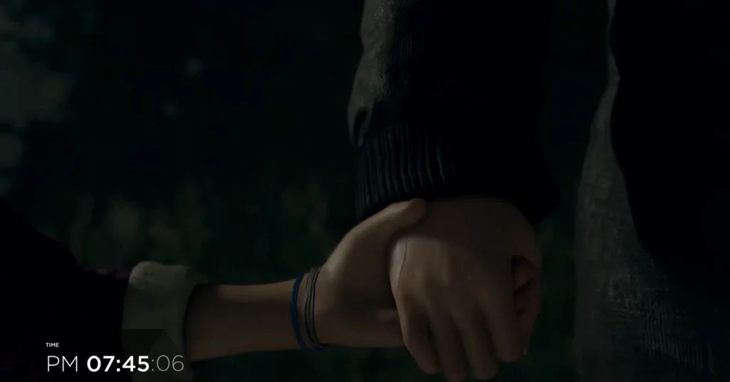 Two hands holding in dark room with timestamp