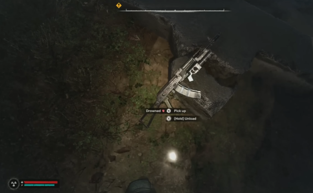 Assault rifle lying on riverbank in-game