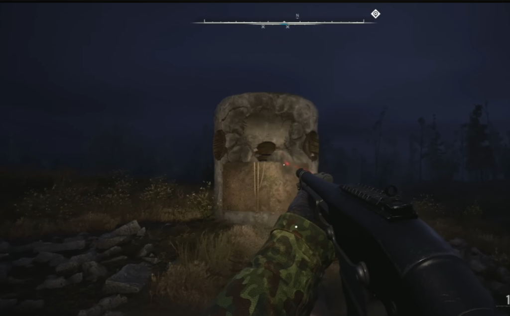 First-person aiming rifle at stone monument outdoors