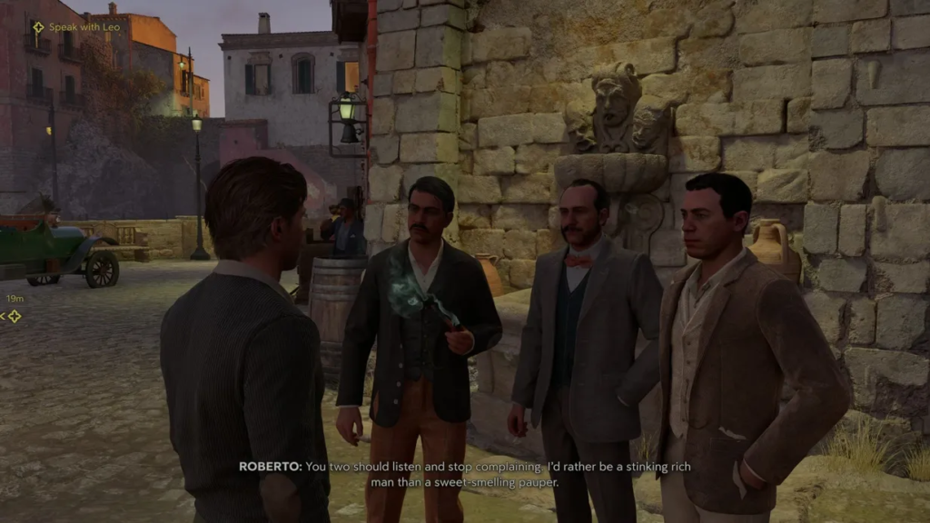 Men talking beside stone wall fountain in town