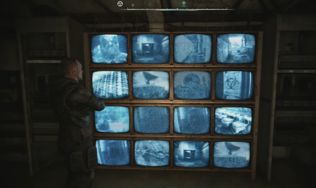 Man watching blue security monitors indoors
