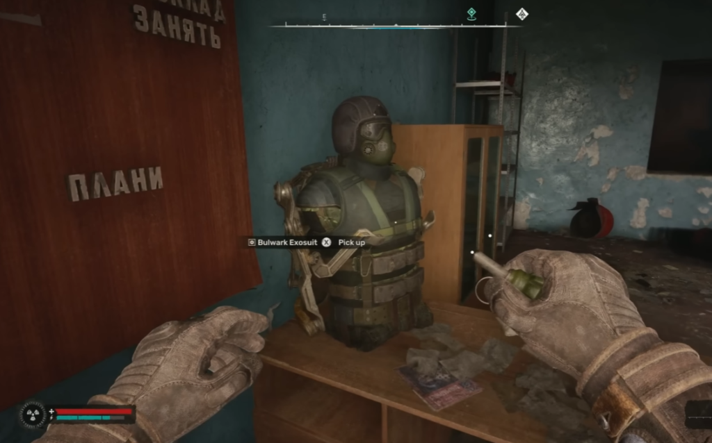 Player picking up Bulwark Exosuit indoors
