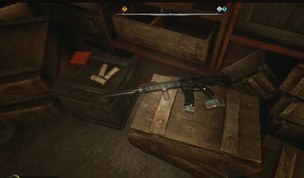 Black rifle lying on wooden crates