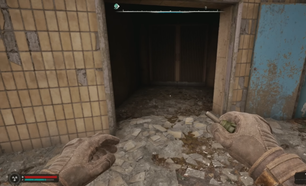 Gloved hands holding grenade in doorway