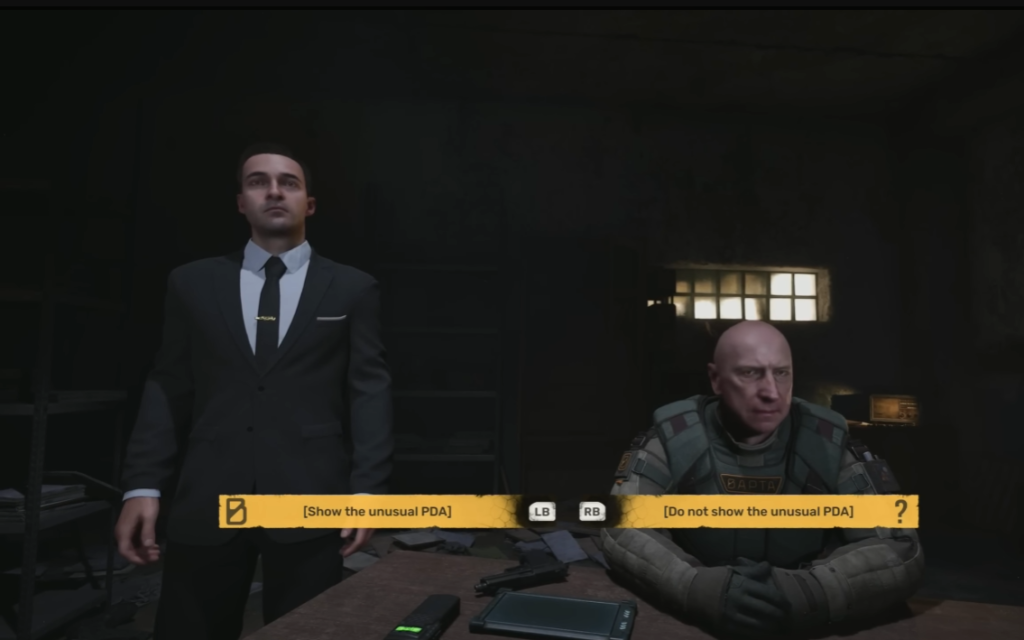 Two men in room at table