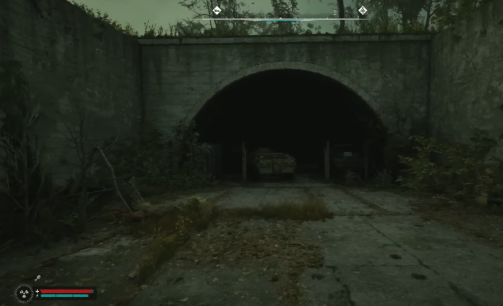 Player approaches dark tunnel entrance outdoors