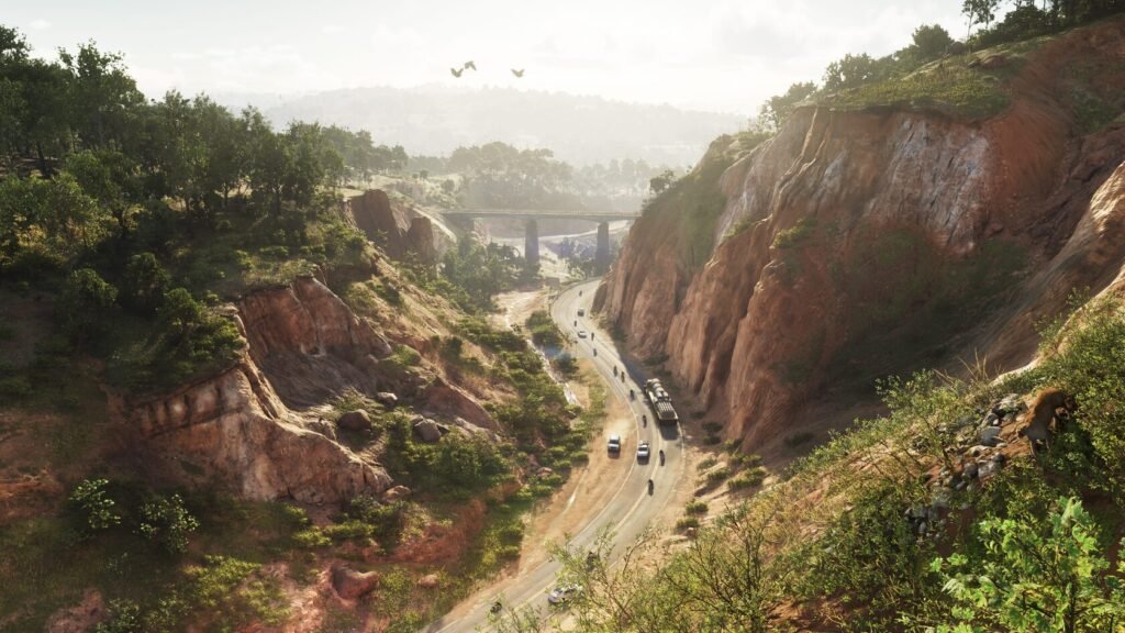 Cars and truck driving on winding canyon road