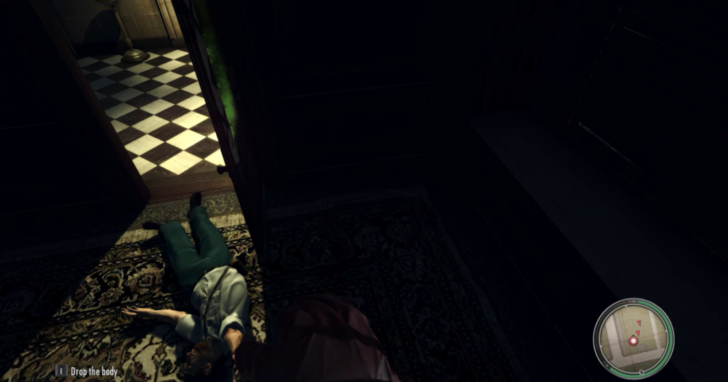 Man lying on rug, dark room.