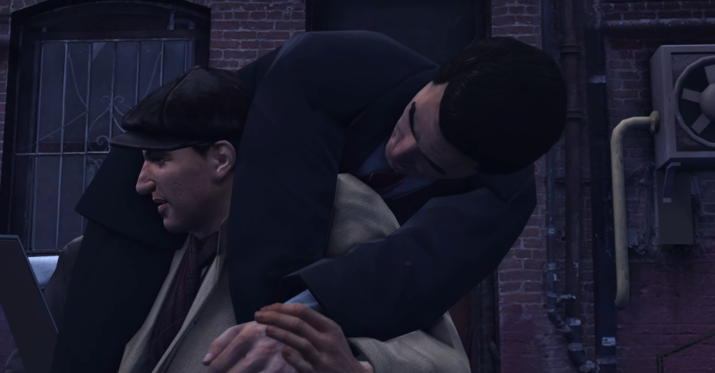 Man in suit grappling another man.