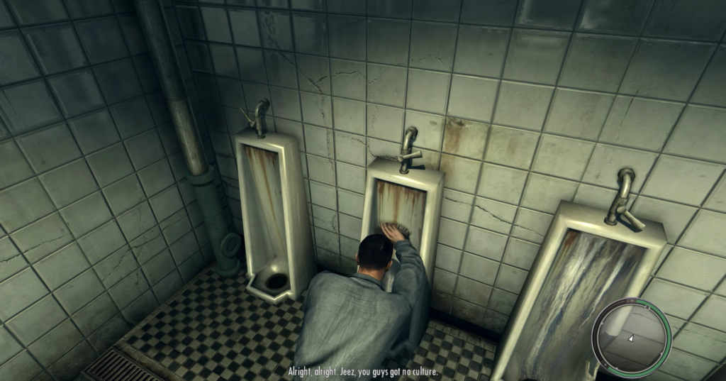 Man washing hands at urinal.