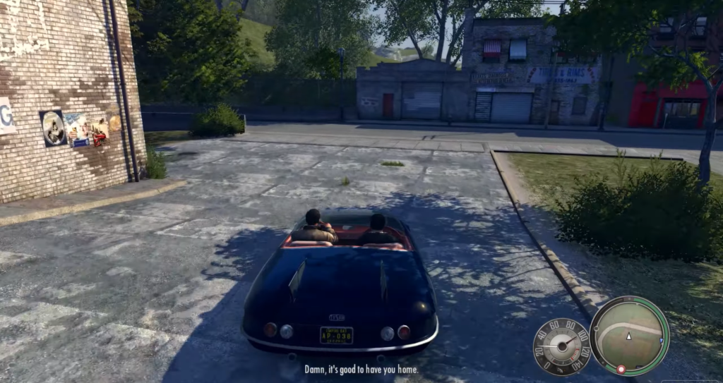 Two men driving black convertible car.