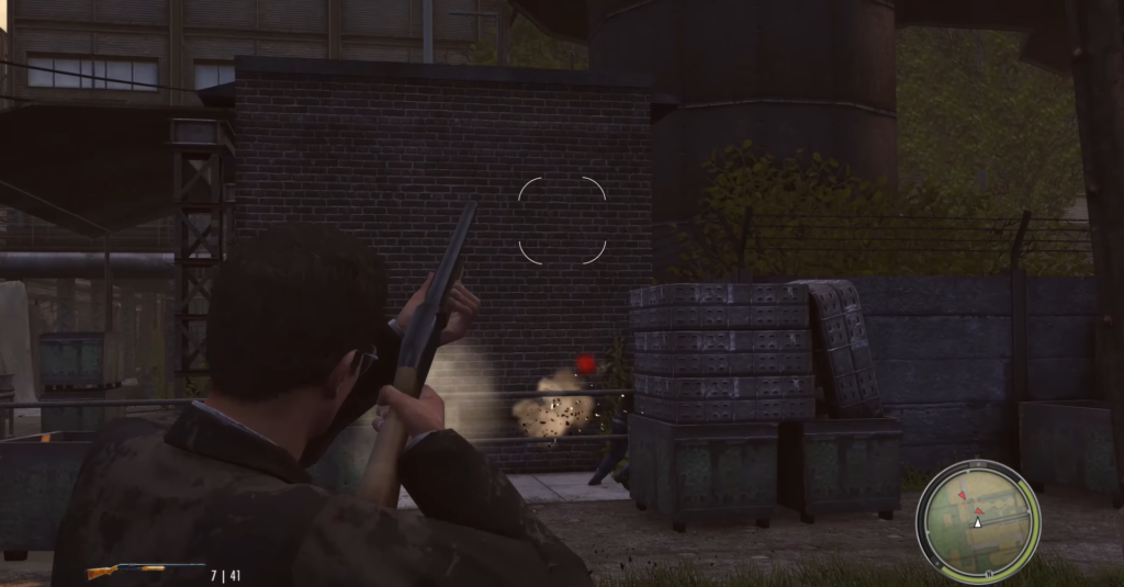 Man aiming shotgun at enemy behind crates.