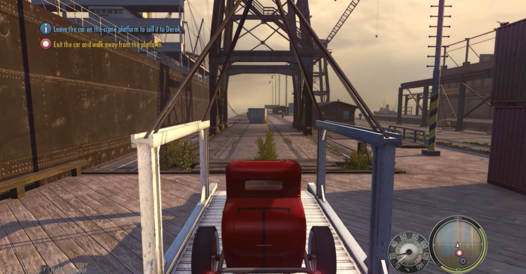 Red vintage car on wooden dock.