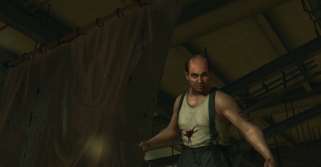 man with bloodstained shirt in warehouse