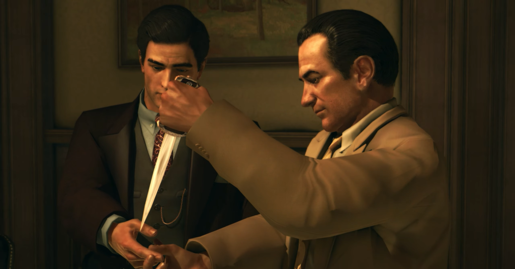 Two men examining a sword together.