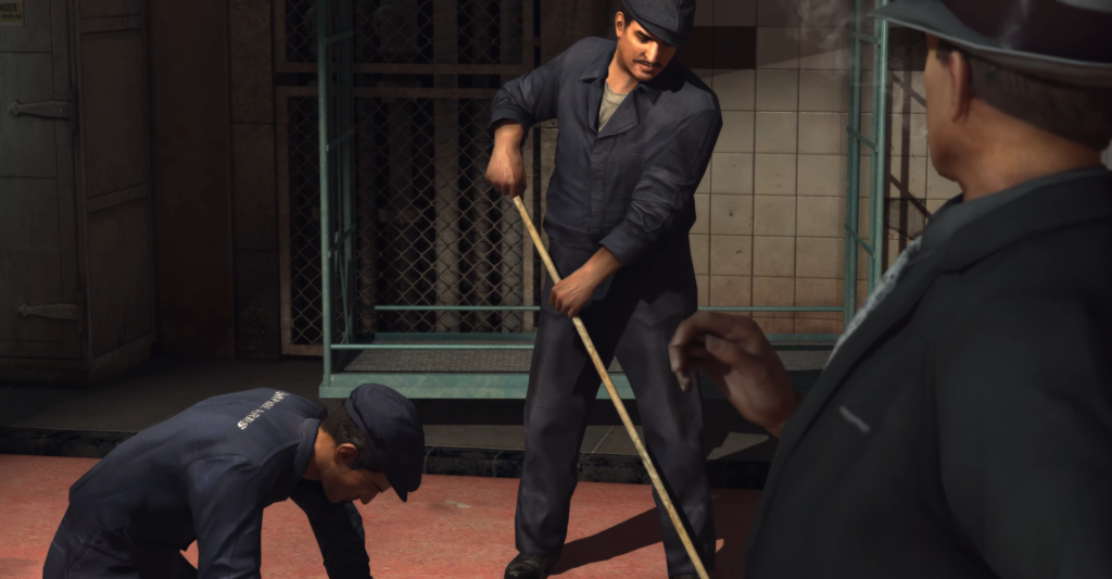 Men cleaning floor in blue uniforms.