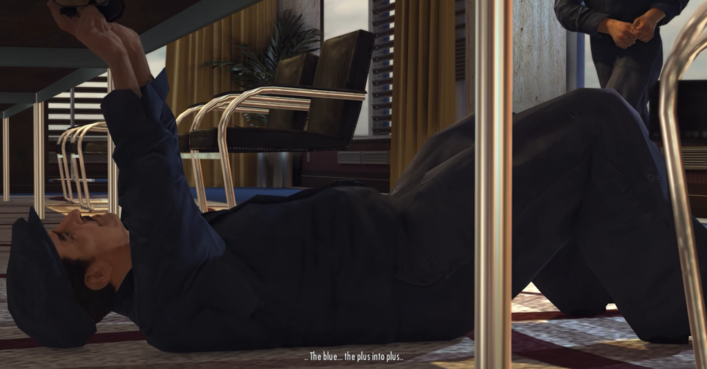 man lying under table holding gun