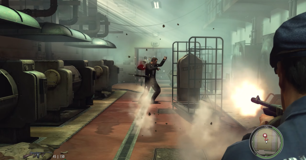 Man shooting in industrial setting, smoke.