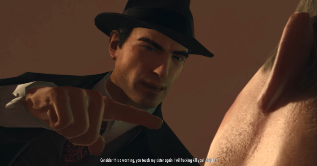 Man in hat threatening with finger.