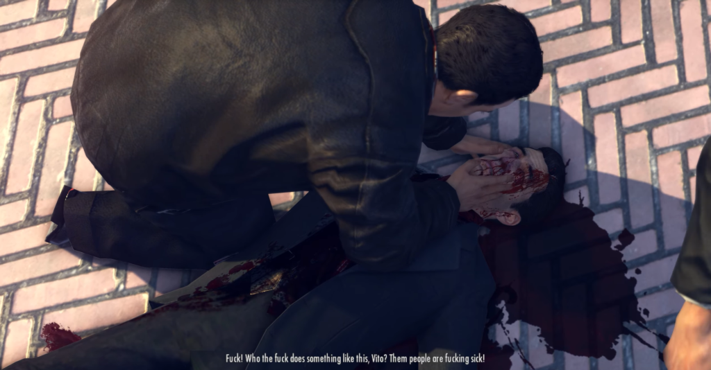 Man kneeling over bloodied body, distressed.