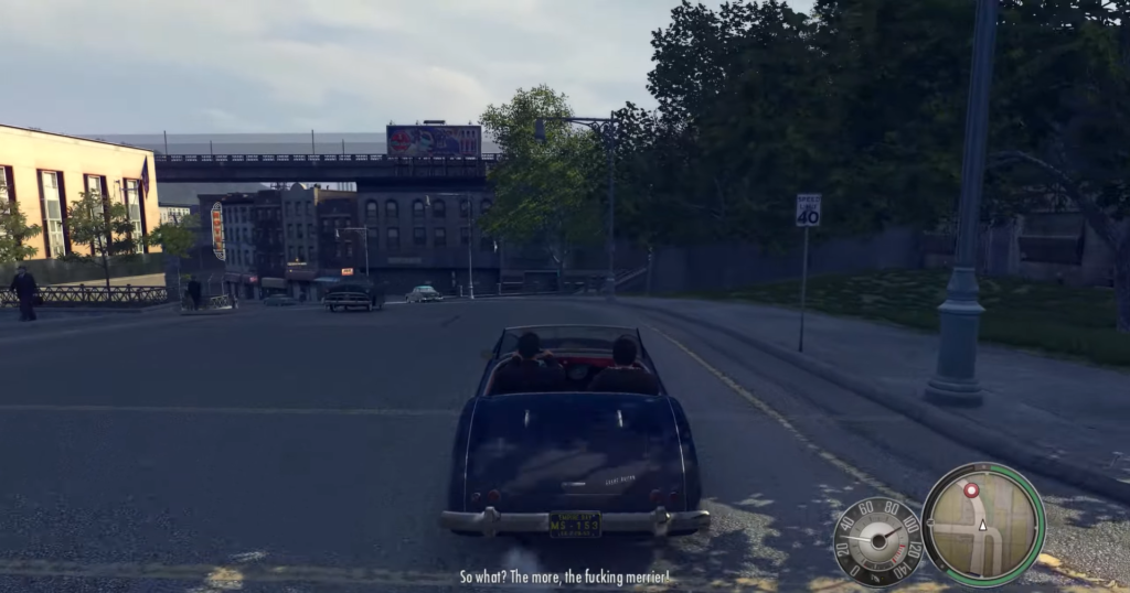 Classic car driving down city street.
