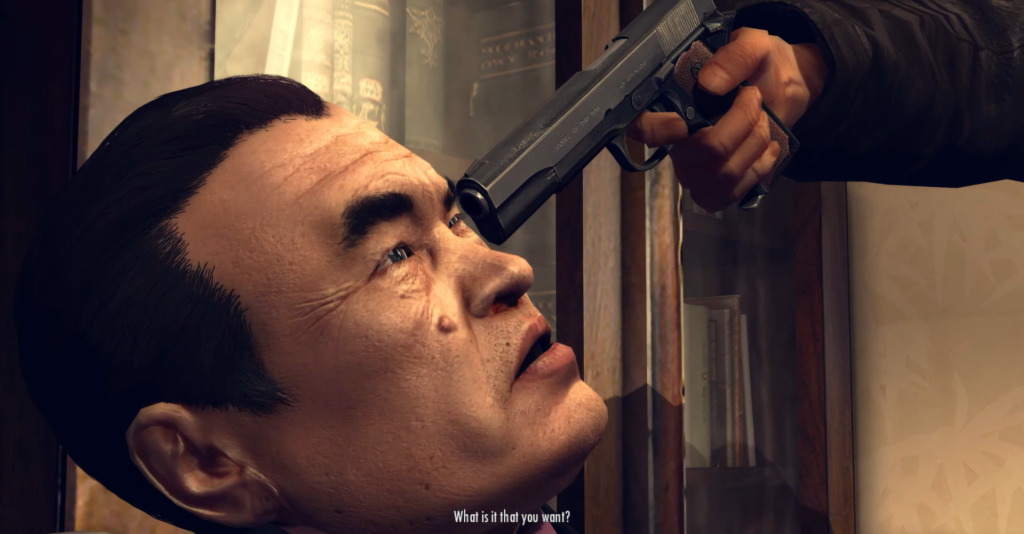 Gun aimed at man's forehead, tension.