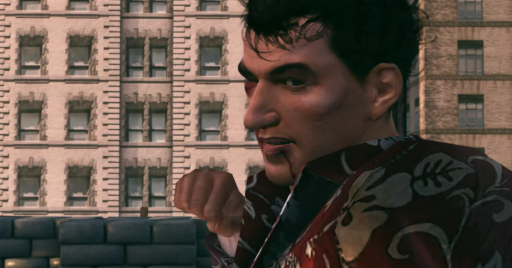 Man in red floral shirt smirking.