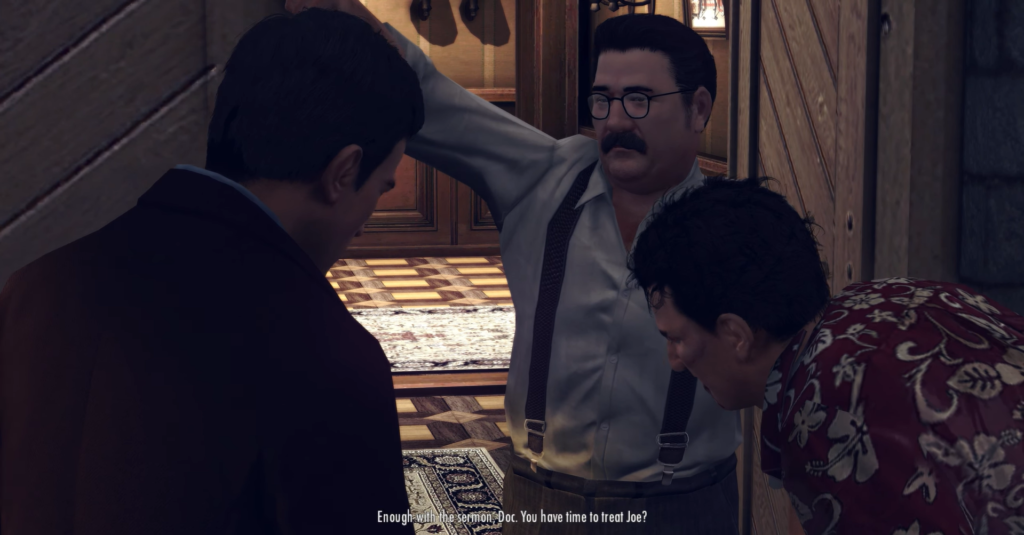 Three men discussing over patterned rug.