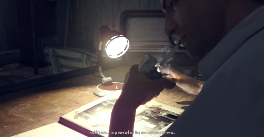 Man smoking, reading photo album.