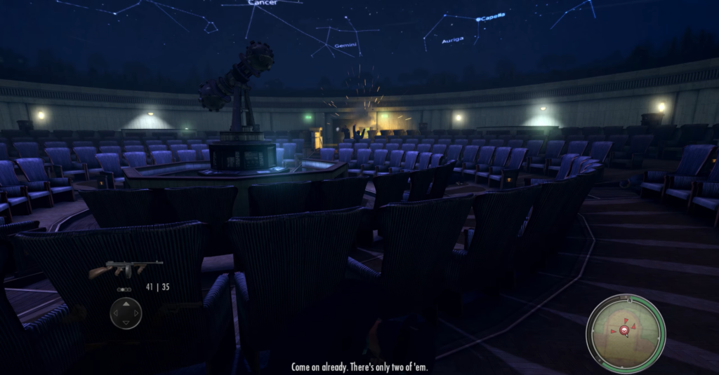 Empty auditorium with blue chairs.