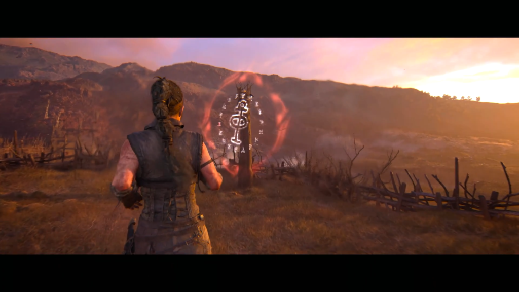 Senua approaches glowing rune stone in Hellblade: Senua's Sacrifice