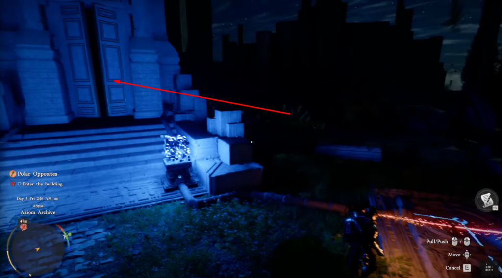 Red arrow pointing at blue building doors at night