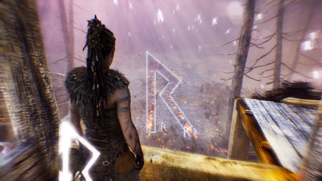 Senua stands overlooking glowing rune in misty forest