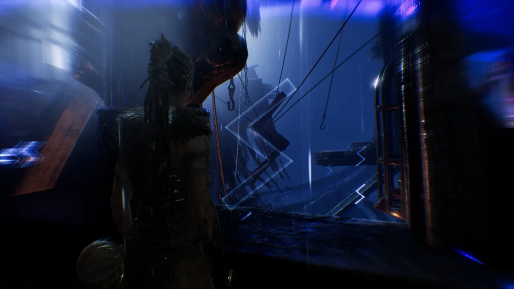 Warrior stands in blue rain near wreckage