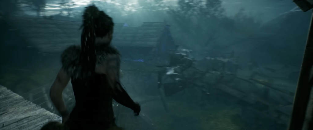 Senua watches a shipwreck in foggy water
