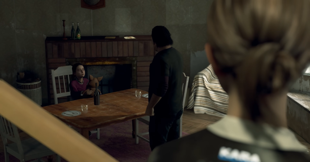 Kara watches Alice holding a toy at table