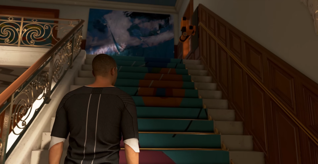 Man walking up teal staircase inside building
