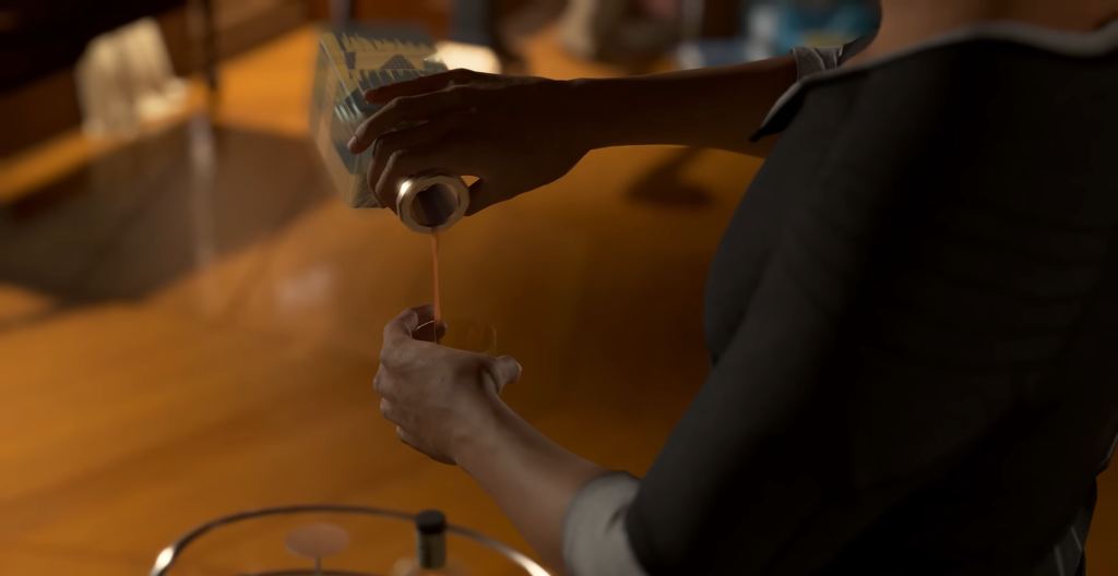 Person pouring orange juice into glass on table