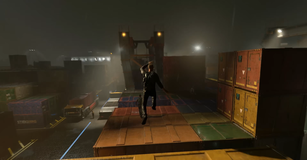 Man jumping across shipping containers at night dock