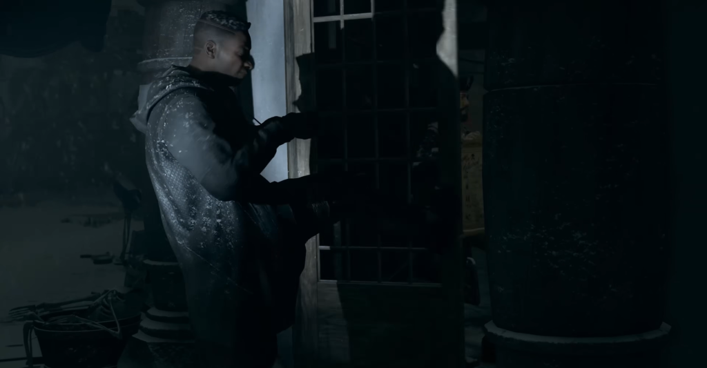 Man kicks door inside dark building entrance