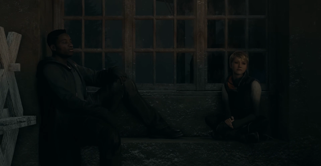 Two people sitting by windows in dark room