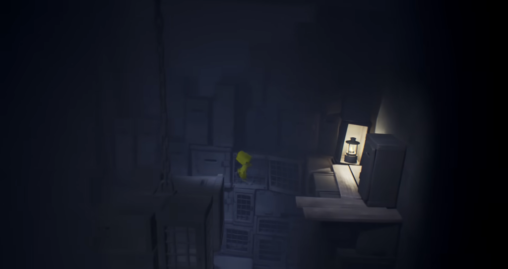 Six from Little Nightmares climbing crates in dark room