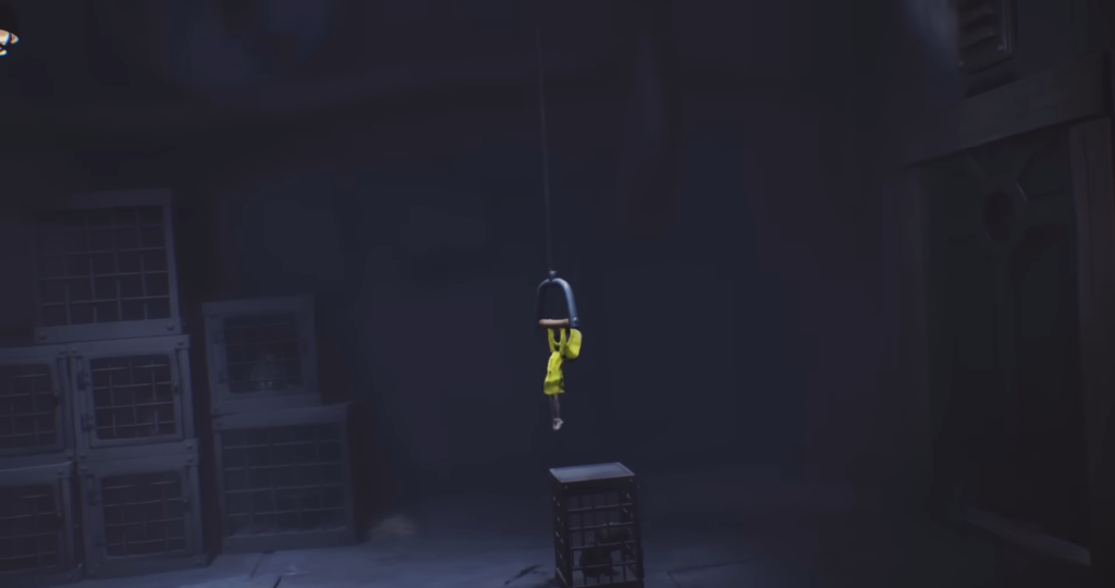 Kratos climbs chain inside wooden structure in God of War