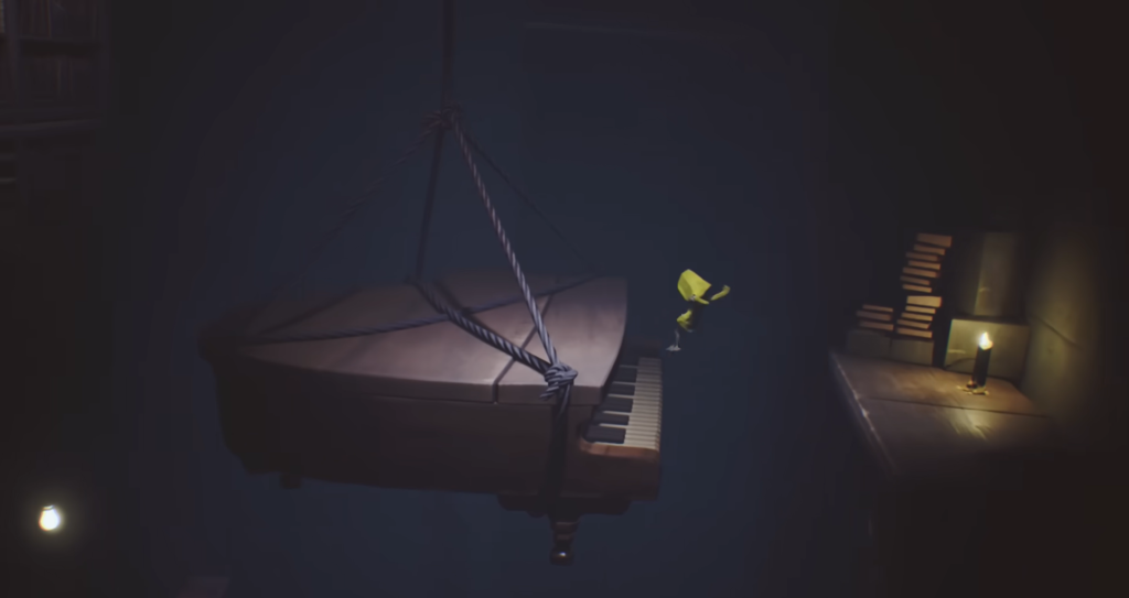 Six from Little Nightmares jumps near hanging piano