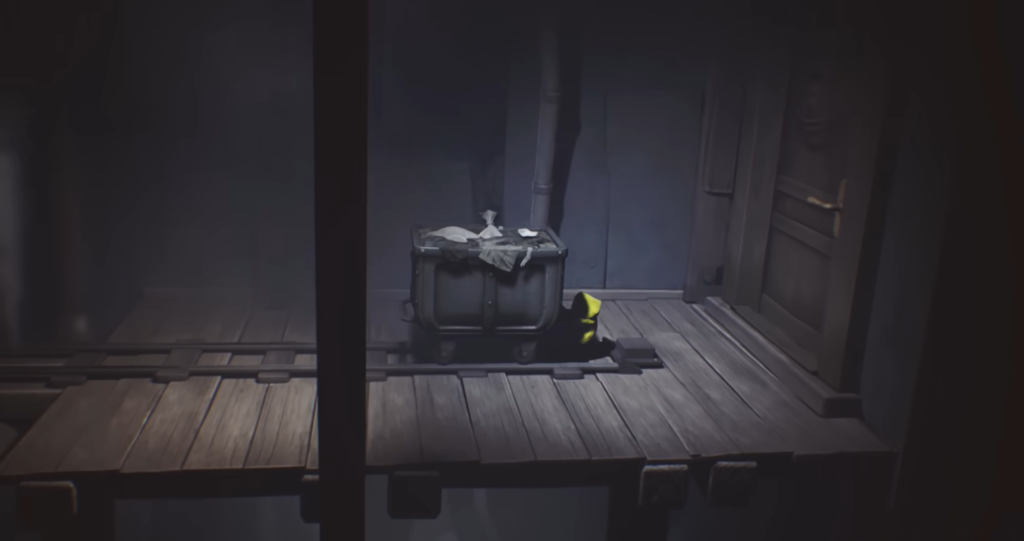 Yellow raincoat figure hiding behind crate on wooden platform