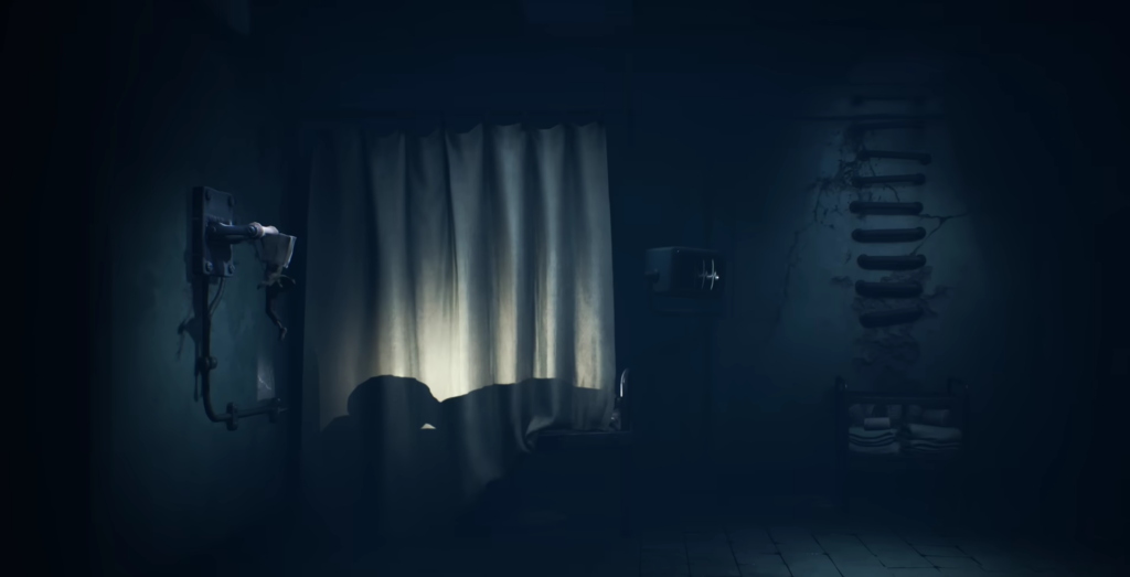 Curtained window glowing in dark room with pipes