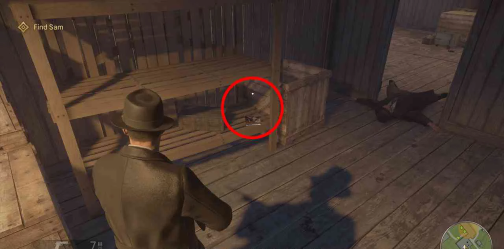 Mafia: Definitive Edition player aiming at wooden bench indoors
