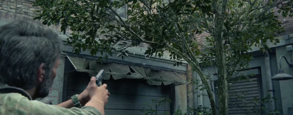 Man aiming handgun near building under trees