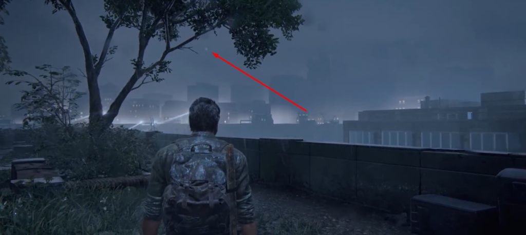 Man with backpack looking at rainy city skyline